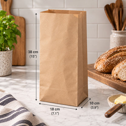 A brown paper bag standing on a marble countertop in a kitchen setting, with measurement arrows and labels showing its dimensions: 38 cm tall, 18 cm wide, and 10 cm deep.